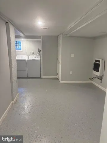a view of a storage & utility room with cabinets