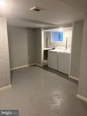 a view of a roof deck with table and chairs with wooden floor and fence