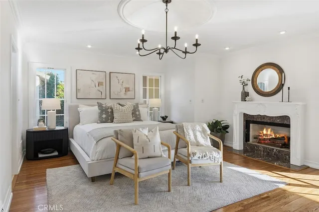 a bedroom with a bed and a fireplace