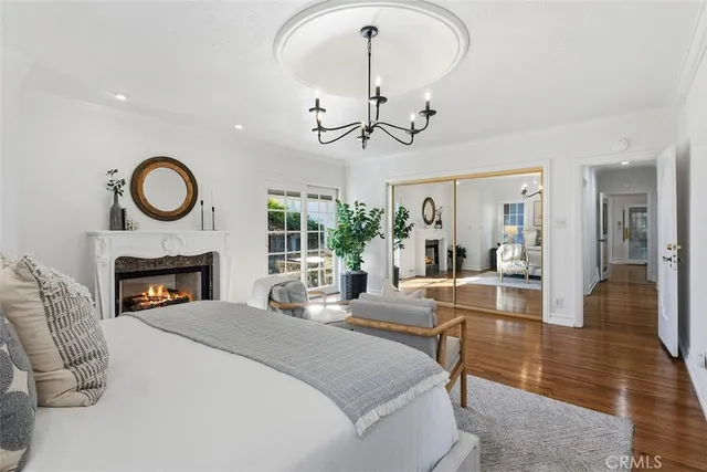 a view of a livingroom with fireplace dining table and chairs