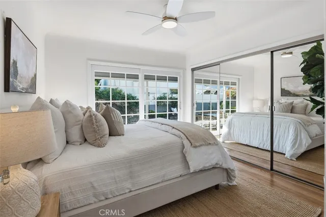 a bedroom with a large bed and a large window