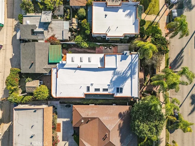 an aerial view of a house with outdoor space