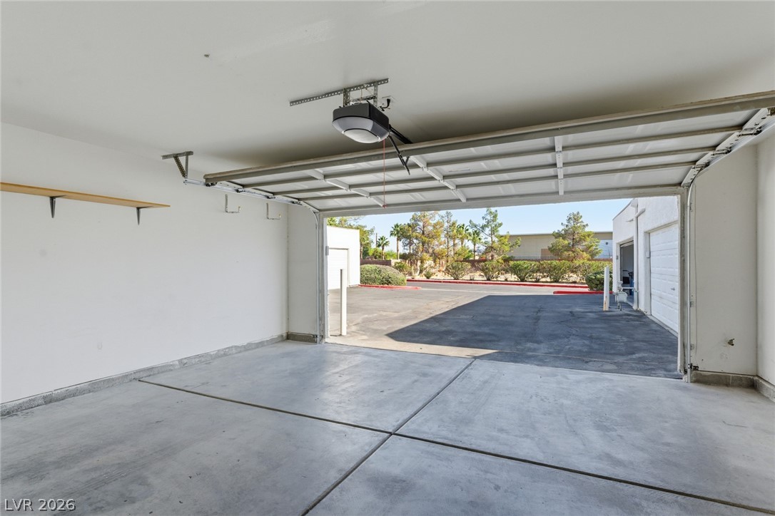 5449 Bugle Way, Unit 104 Las Vegas, NV 89108 - Photo 5 of 33 This spacious garage offers ample storage and direct access to outdoor parking.