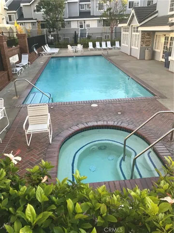 a view of a swimming pool with a patio