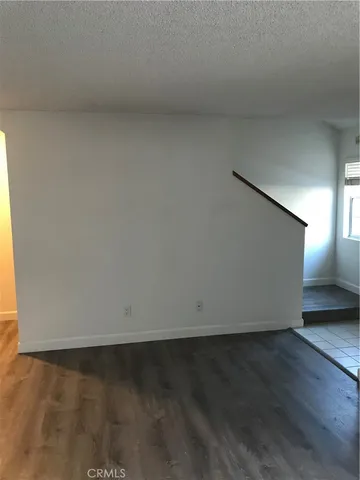 an empty room with wooden floor