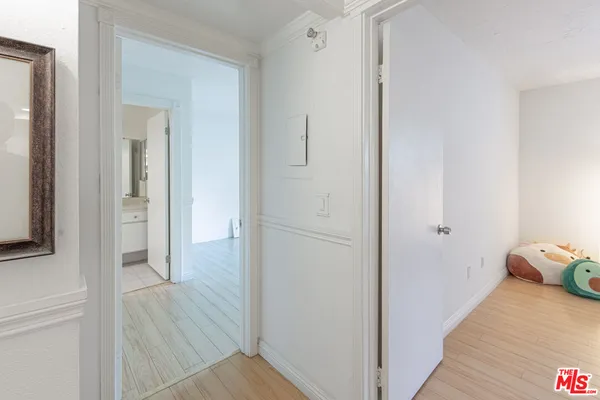 a view of a bedroom from a hallway