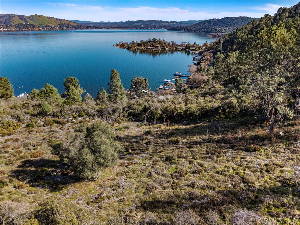 11390 Point Lakeview Road Lower Lake, CA 95457 - Photo 5 of 29 a view of a lake with mountain