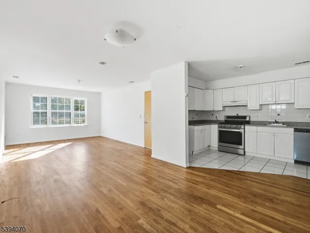 a view of kitchen with wooden floor