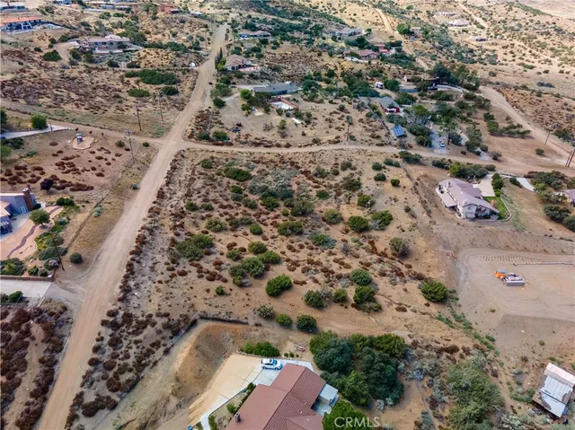 an aerial view of house with yard