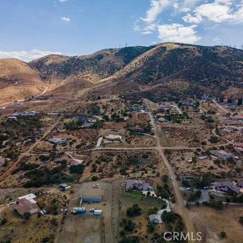 an aerial view of residential house and outdoor space