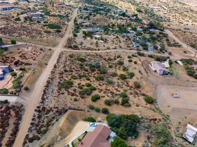 an aerial view of house with yard