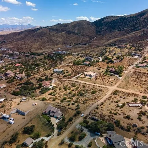 an aerial view of house with yard