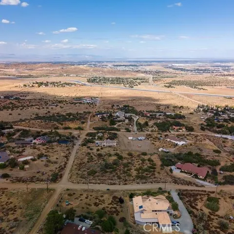 a view of a town with mountains in the background