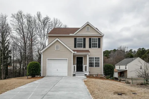 front view of a house with a yard