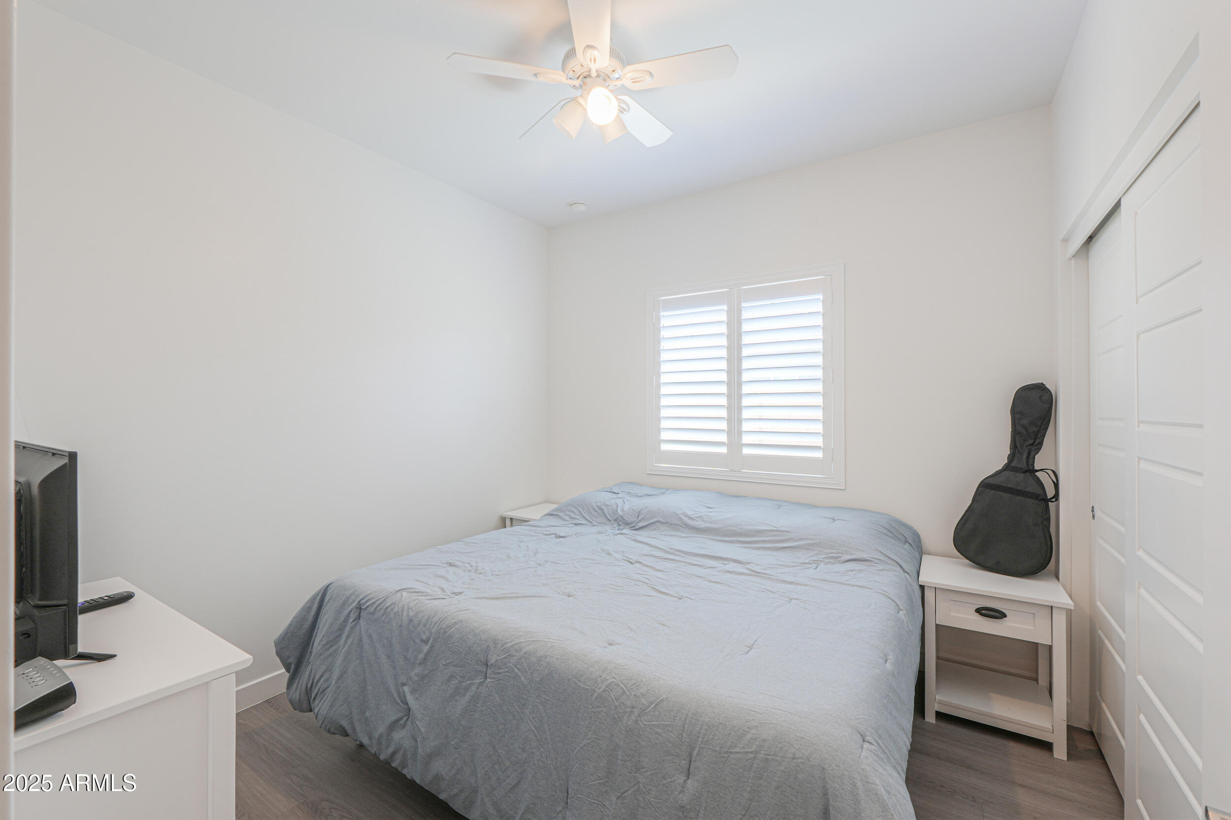 947 East Wiley Way Casa Grande, AZ 85122 - Photo 13 of 36 a bedroom with a bed and a window