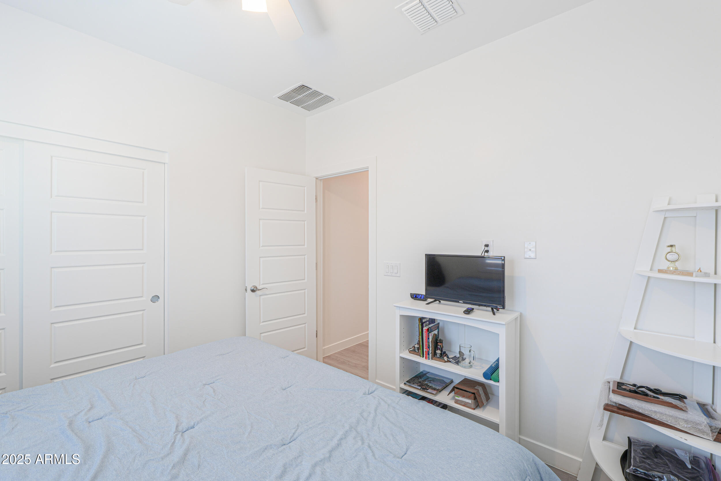 947 East Wiley Way Casa Grande, AZ 85122 - Photo 14 of 36 a room with a bed and a television