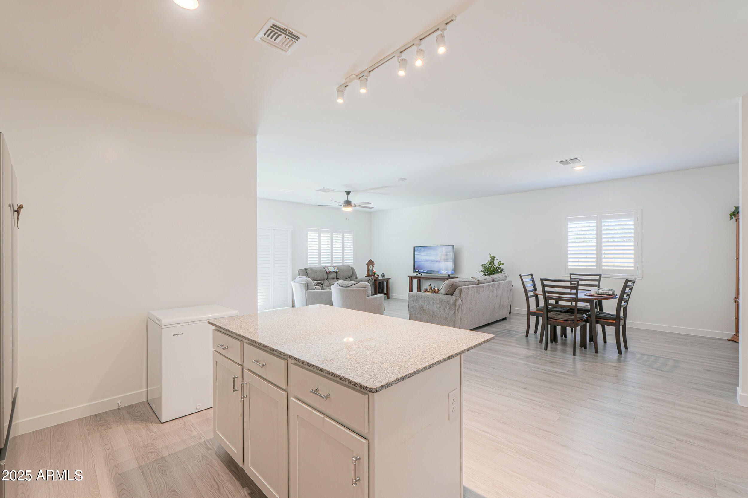 947 East Wiley Way Casa Grande, AZ 85122 - Photo 18 of 36 a view of a dining room with furniture and chandelier