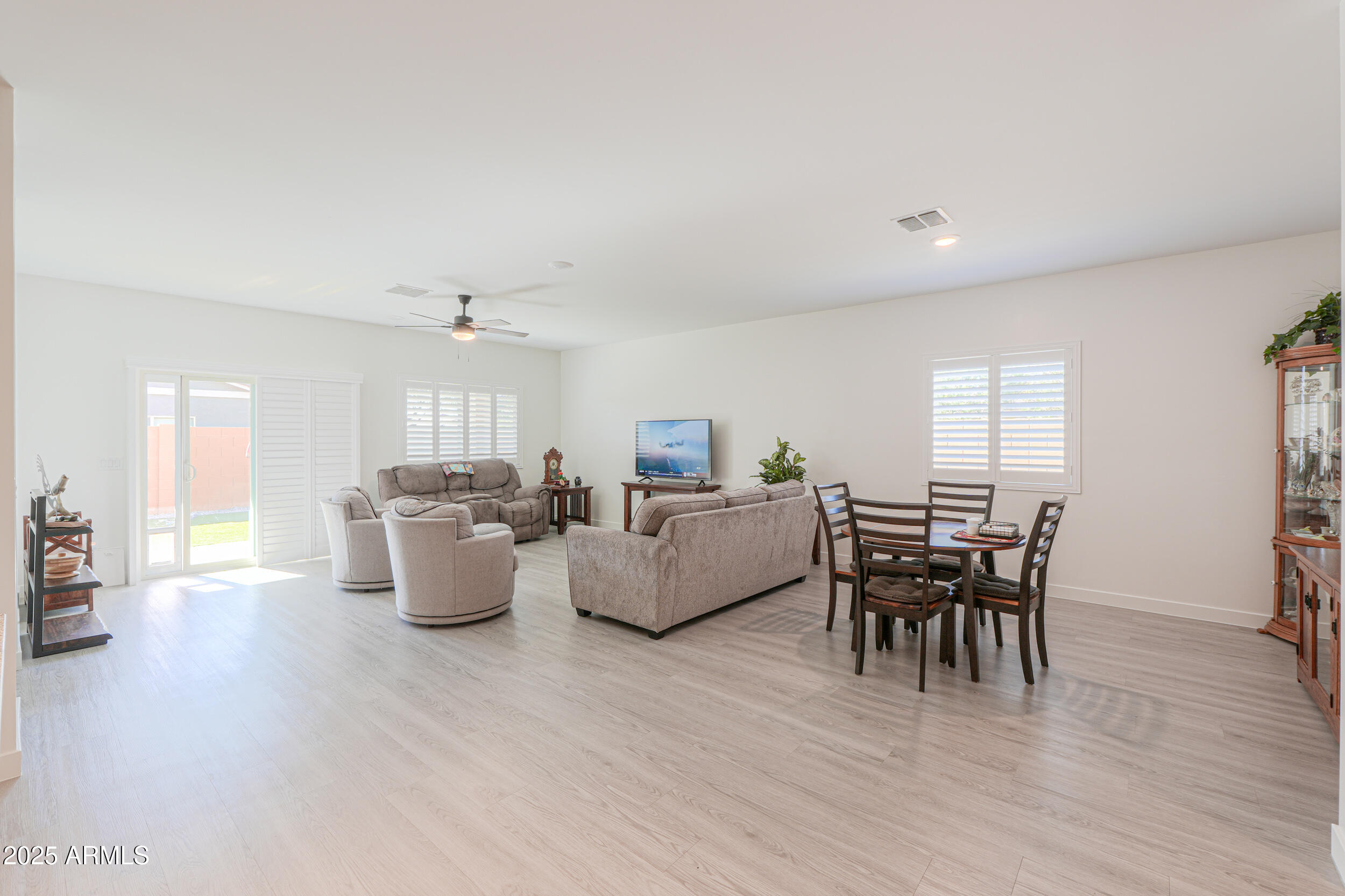 947 East Wiley Way Casa Grande, AZ 85122 - Photo 19 of 36 a living room with furniture a wooden floor and a window