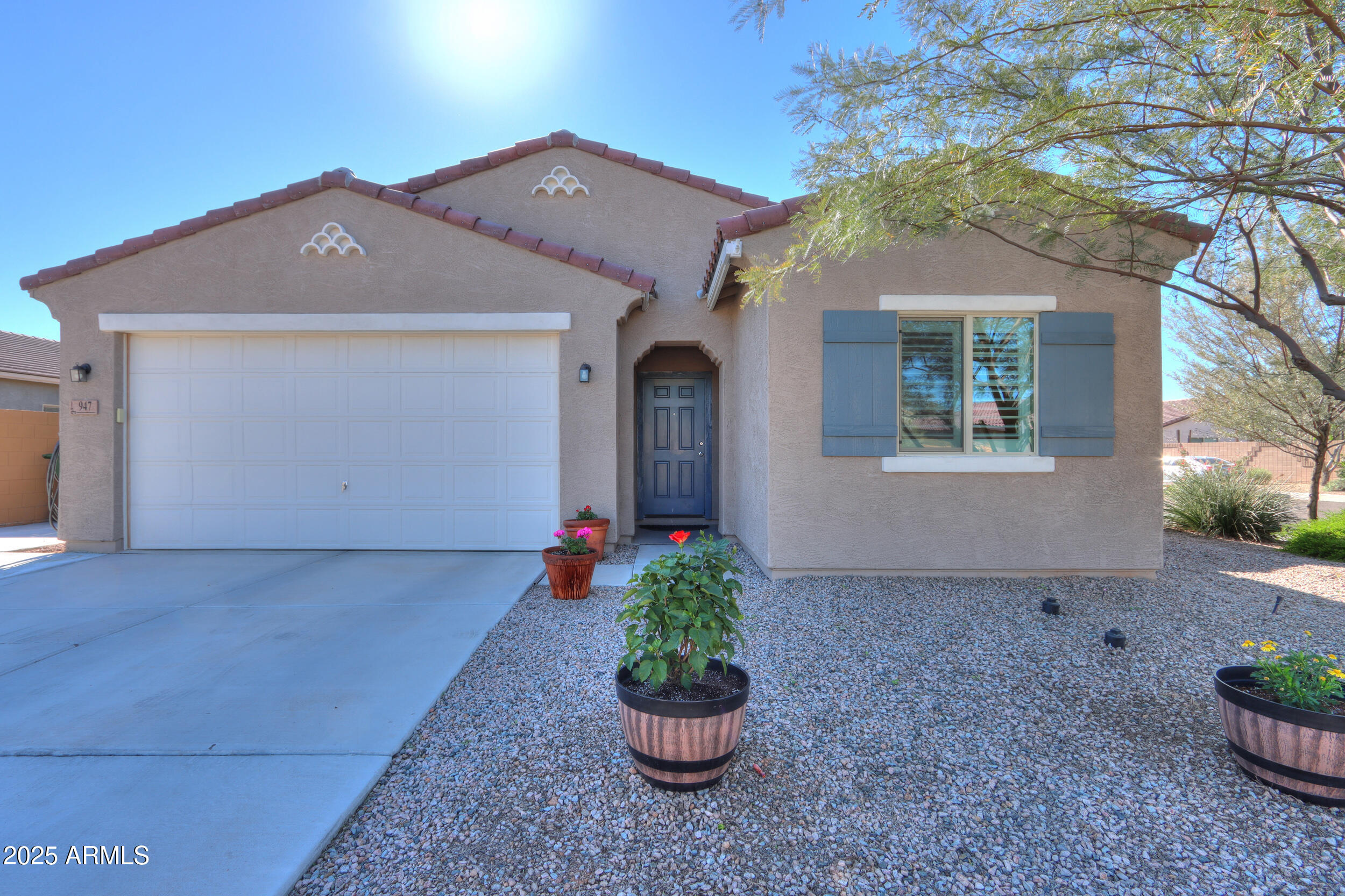 947 East Wiley Way Casa Grande, AZ 85122 - Photo 2 of 36 a front view of a house with a yard