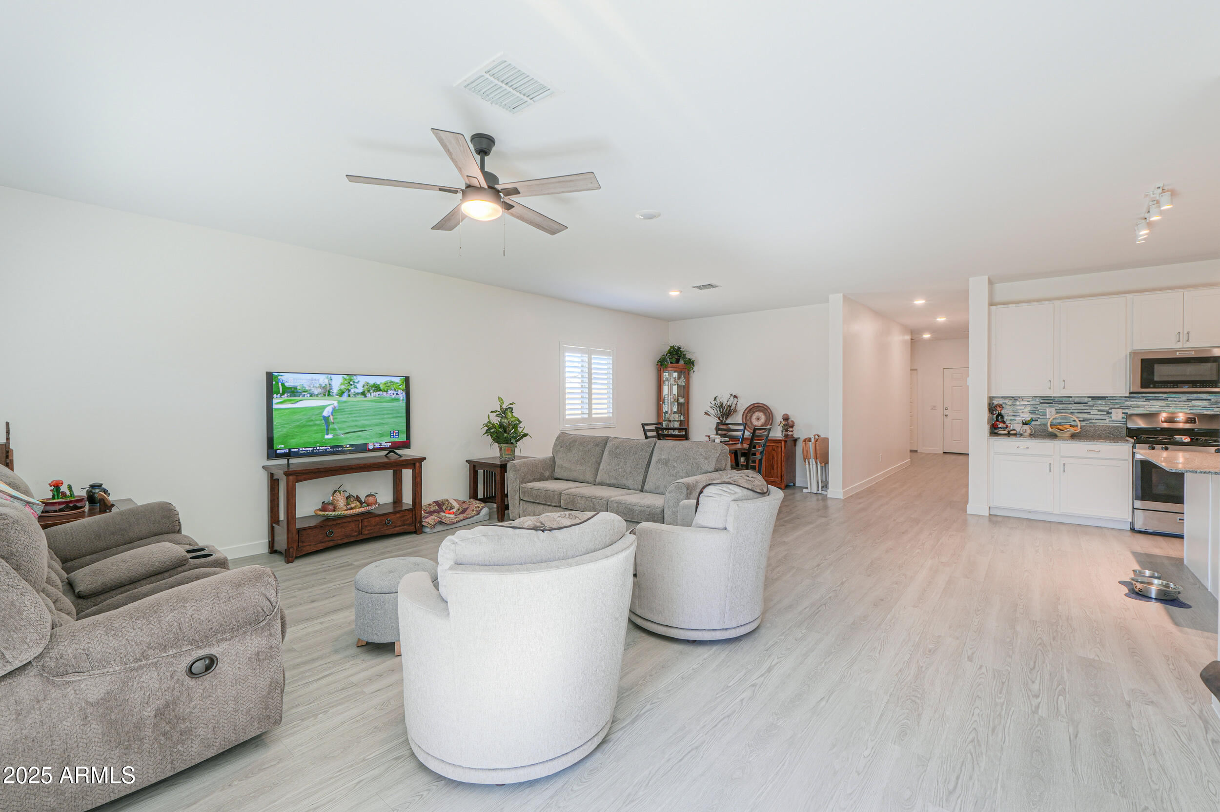 947 East Wiley Way Casa Grande, AZ 85122 - Photo 24 of 36 a living room with furniture and a flat screen tv