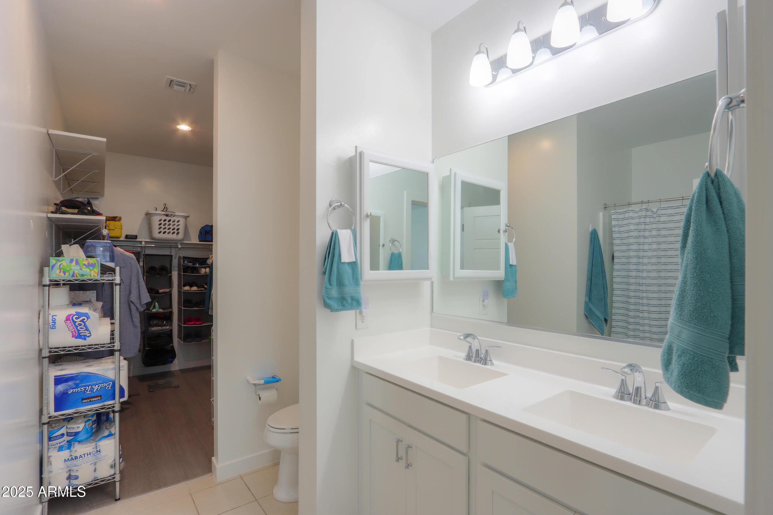 947 East Wiley Way Casa Grande, AZ 85122 - Photo 29 of 36 a bathroom with a sink a vanity and a mirror