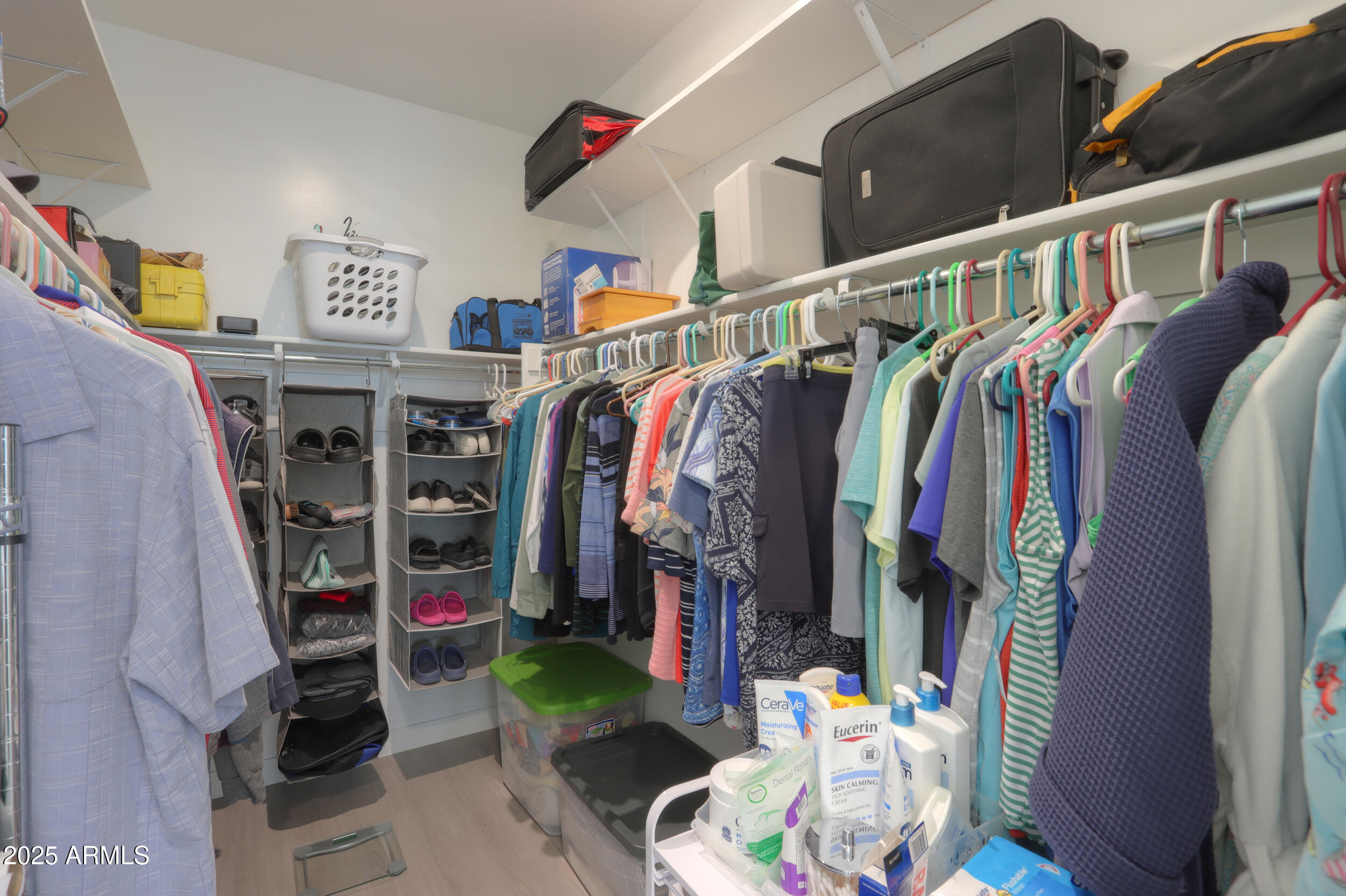 947 East Wiley Way Casa Grande, AZ 85122 - Photo 31 of 36 a view of walk in closet with clothes and shoes