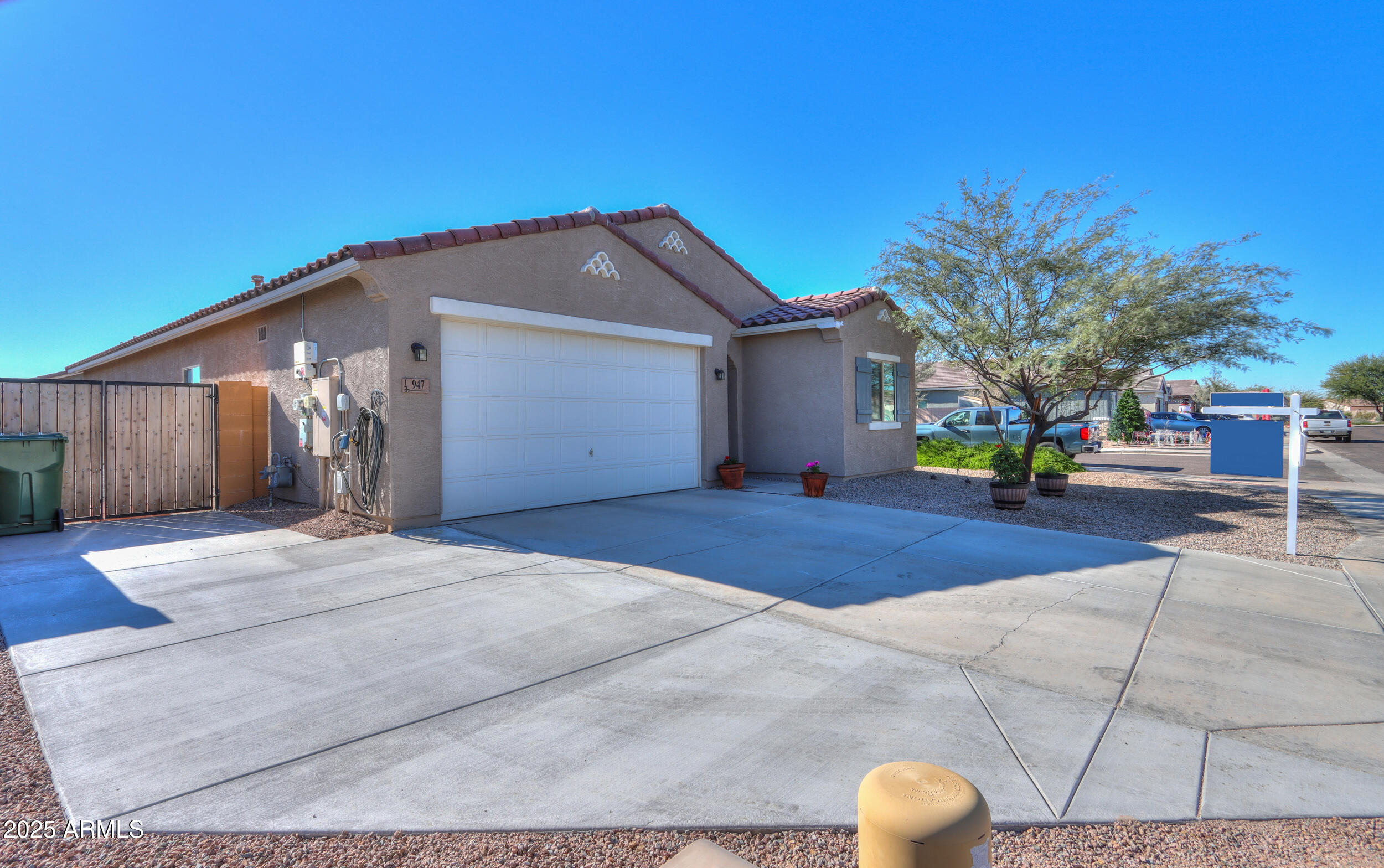 947 East Wiley Way Casa Grande, AZ 85122 - Photo 4 of 36 a front view of a house with a yard and garage