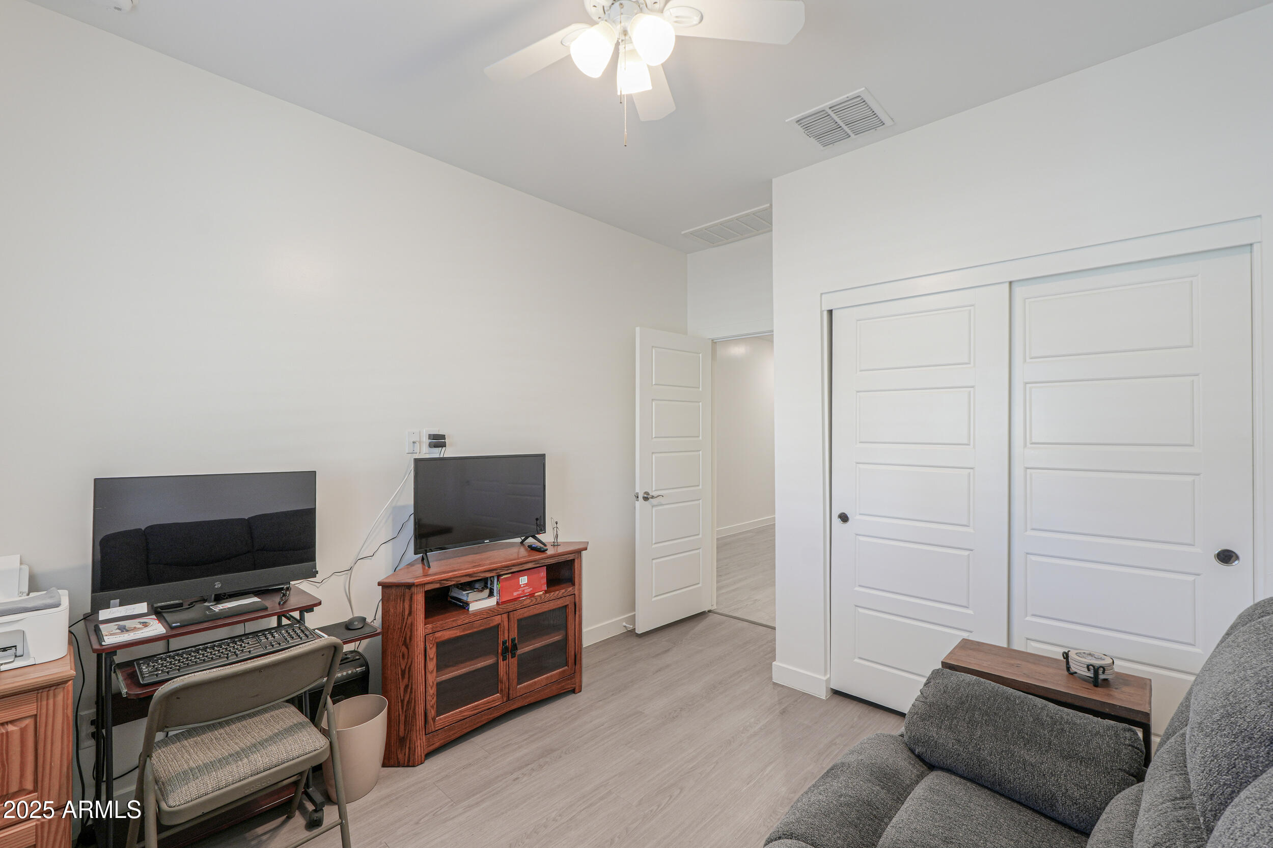 947 East Wiley Way Casa Grande, AZ 85122 - Photo 8 of 36 a living room with furniture and a flat screen tv