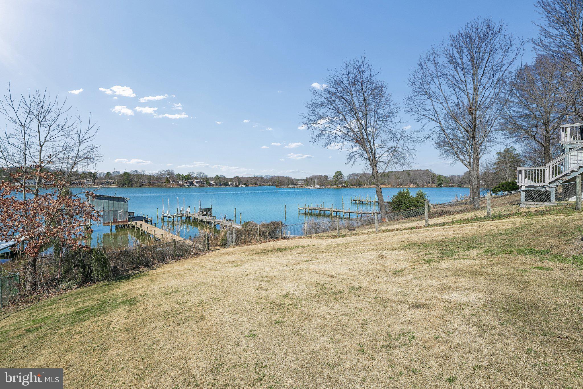 47 Bay View Drive Colonial Beach, VA 22443 - Photo 12 of 17 a view of a lake with houses in the background