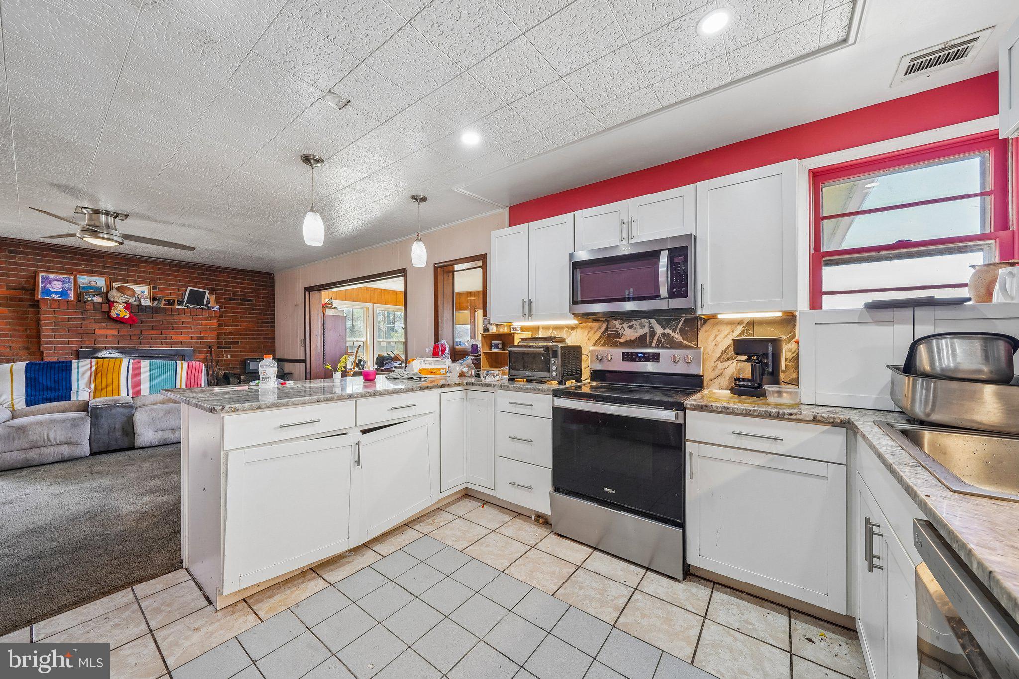 47 Bay View Drive Colonial Beach, VA 22443 - Photo 14 of 17 a kitchen with appliances cabinets and furniture