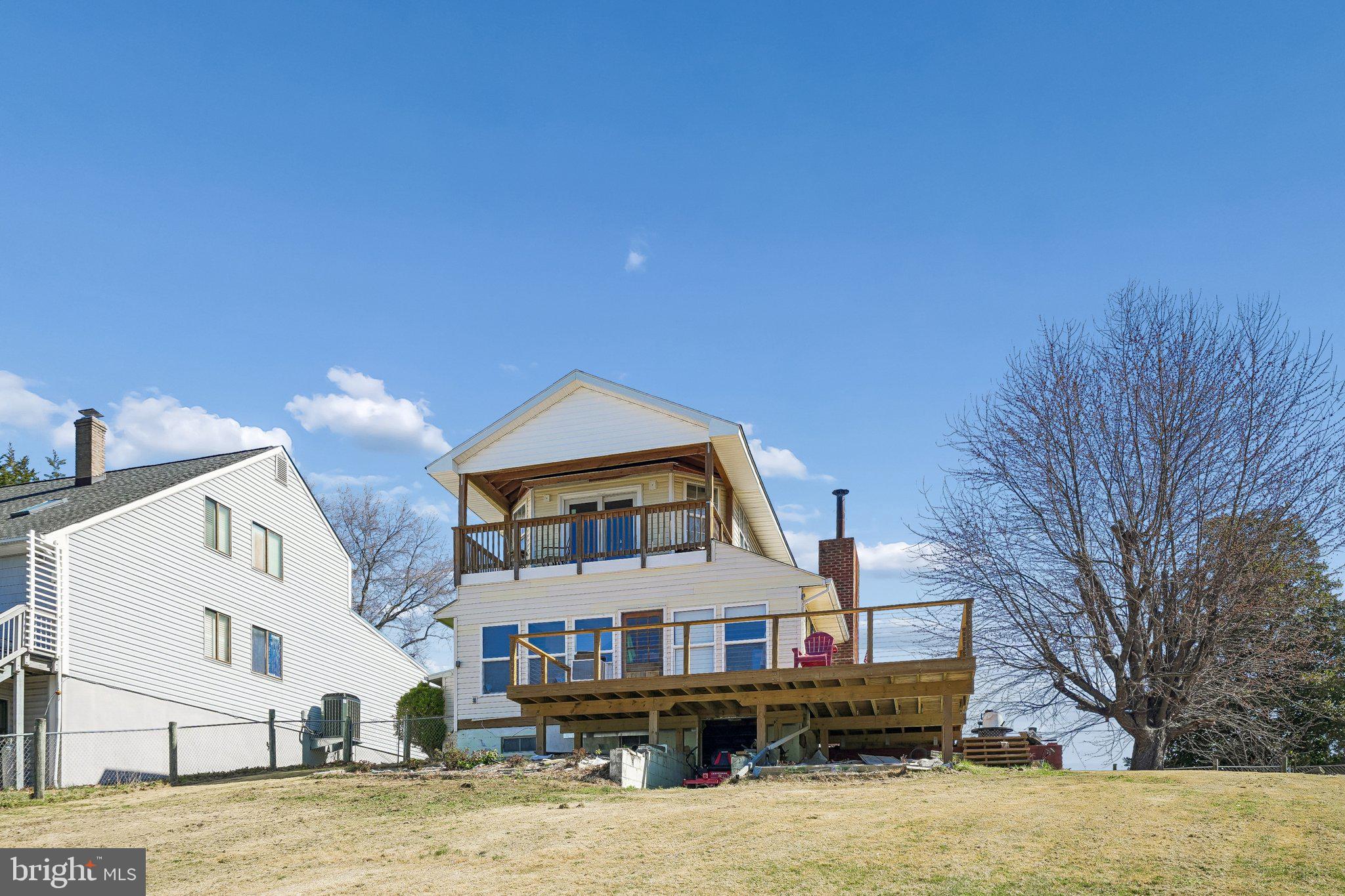 47 Bay View Drive Colonial Beach, VA 22443 - Photo 2 of 17 a front view of a house with a yard