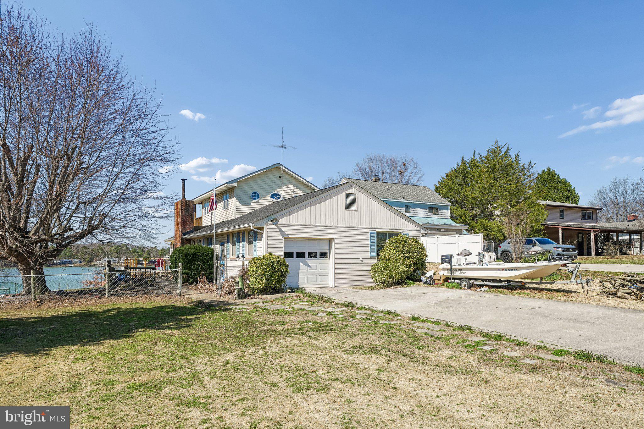 47 Bay View Drive Colonial Beach, VA 22443 - Photo 8 of 17 a front view of a house with a yard