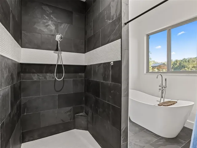 an aerial view of a house with big yard