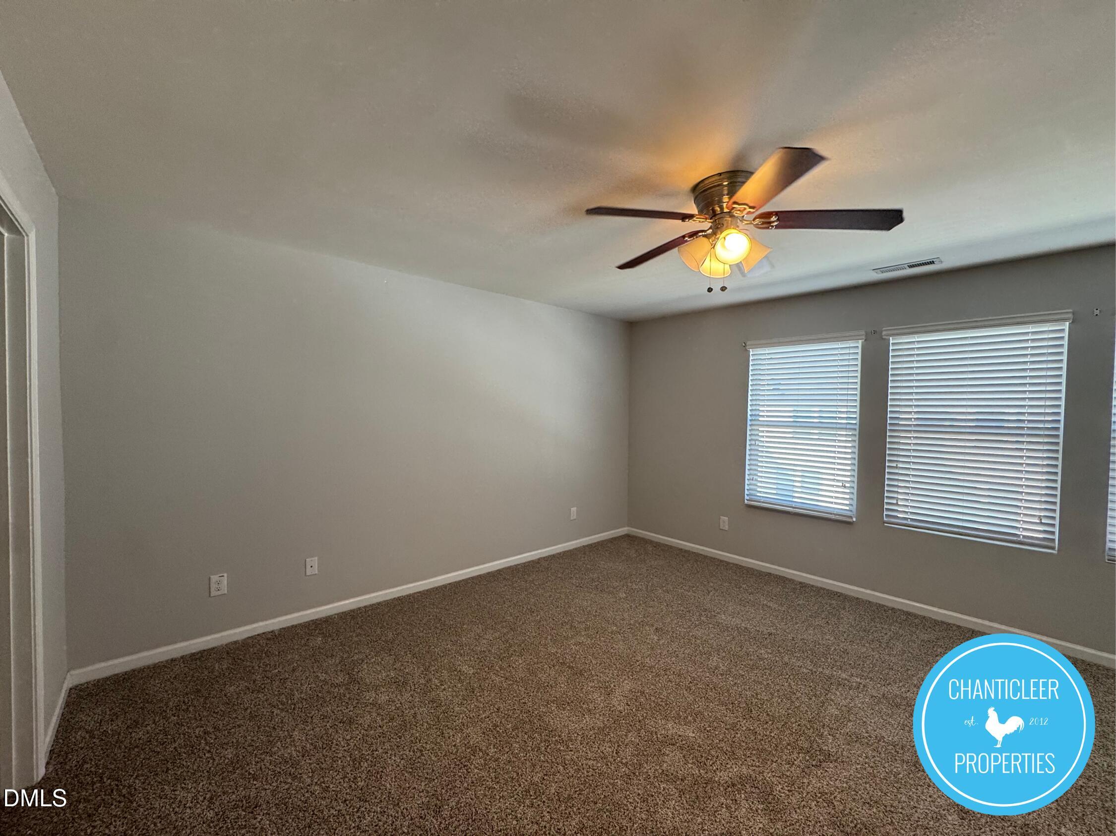 307 Leighann Ridge Lane Rolesville, NC 27571 - Photo 13 of 25 an empty room with windows and fan