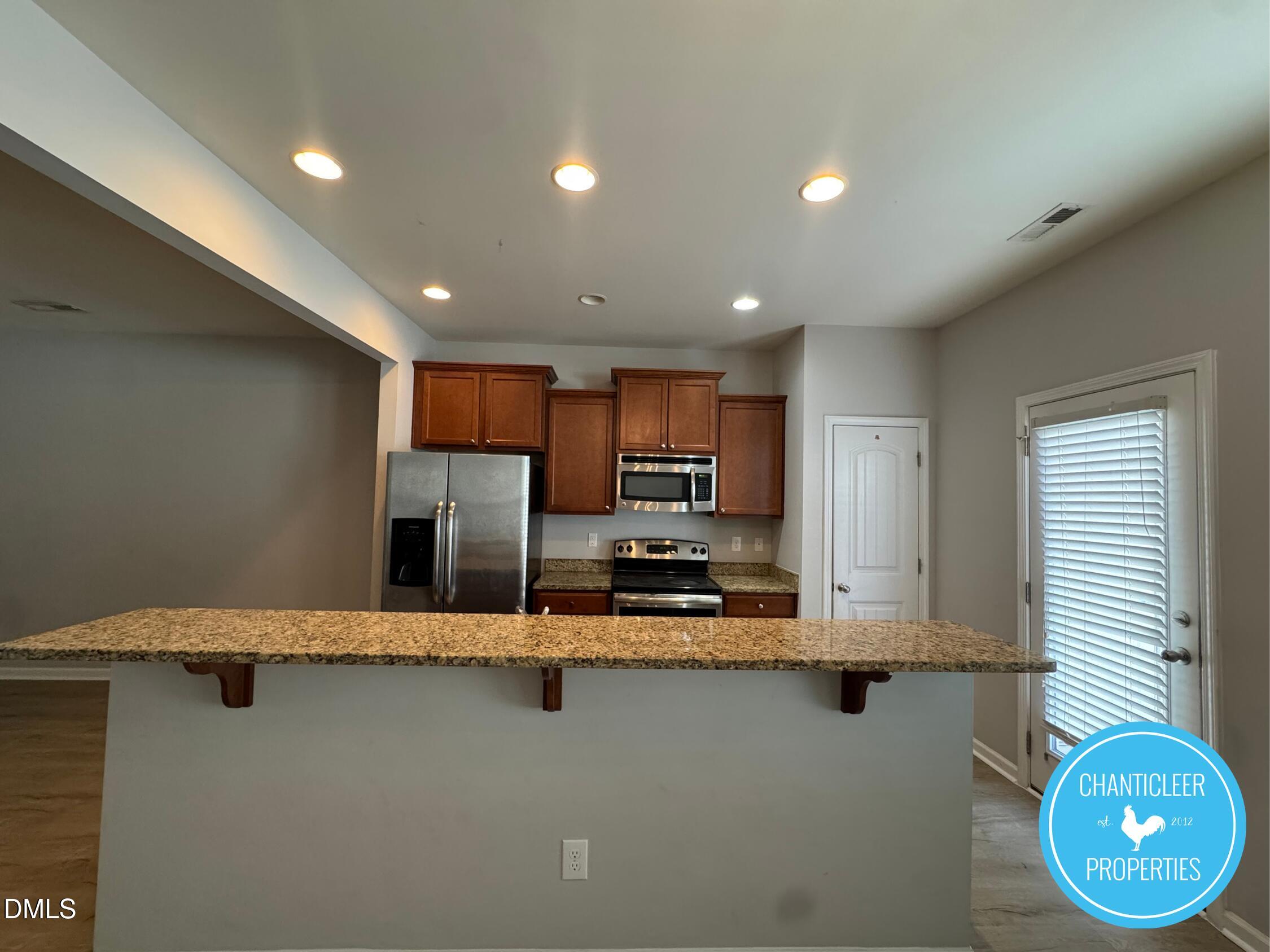 307 Leighann Ridge Lane Rolesville, NC 27571 - Photo 3 of 25 a large kitchen with cabinets