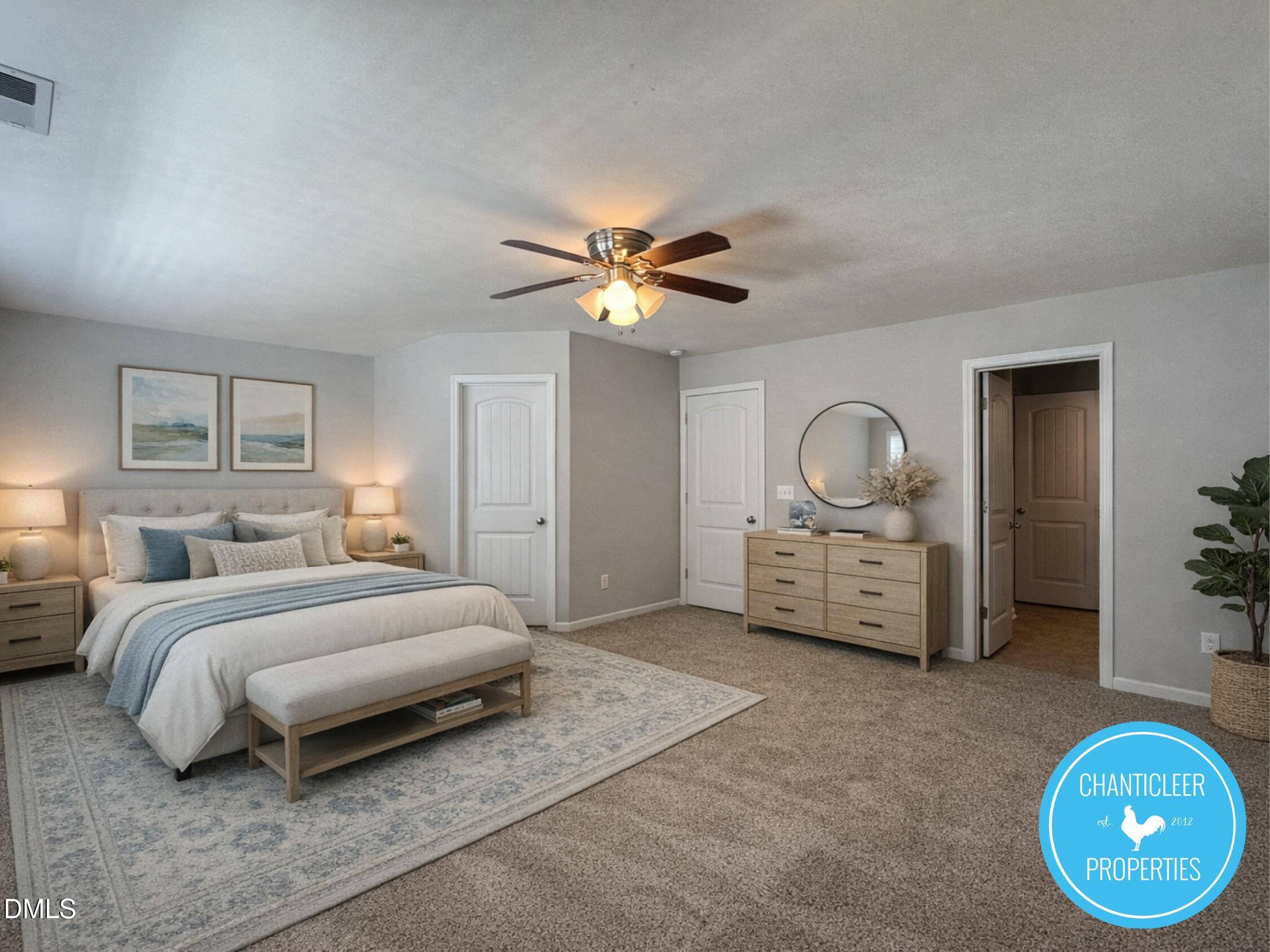307 Leighann Ridge Lane Rolesville, NC 27571 - Photo 7 of 25 a bedroom with bed and a chandelier