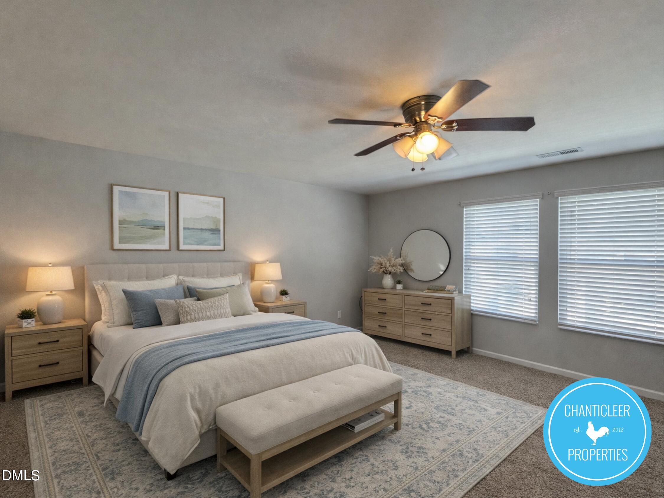 307 Leighann Ridge Lane Rolesville, NC 27571 - Photo 9 of 25 a bedroom with bed and a chandelier