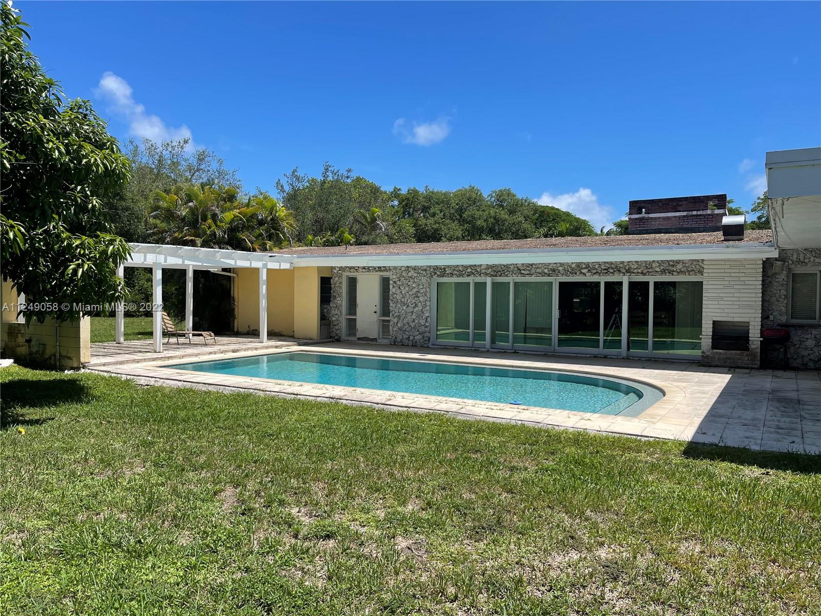 6001 Chapman Field Drive Pinecrest, FL 33156 - Photo 3 of 3 a view of house with a yard