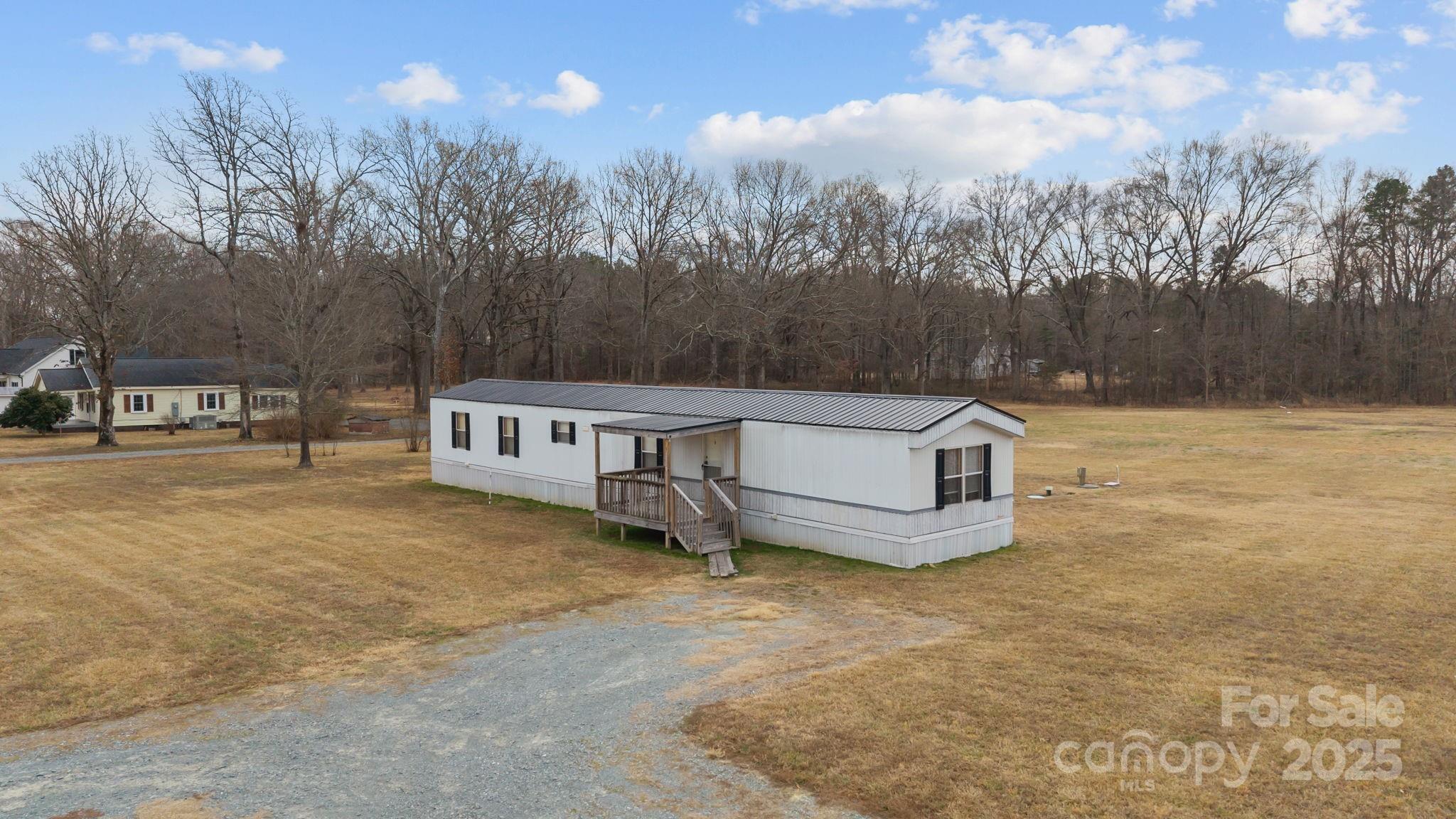 2909 New Town Road Monroe, NC 28110 - Photo 20 of 31 a view of a terrace with a bench and trees