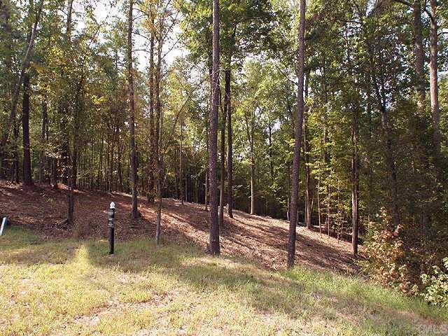 6213 Autry, Unit 3 Raleigh, NC 27613 - Photo 4 of 10 a swimming pool with some trees and wooden fence