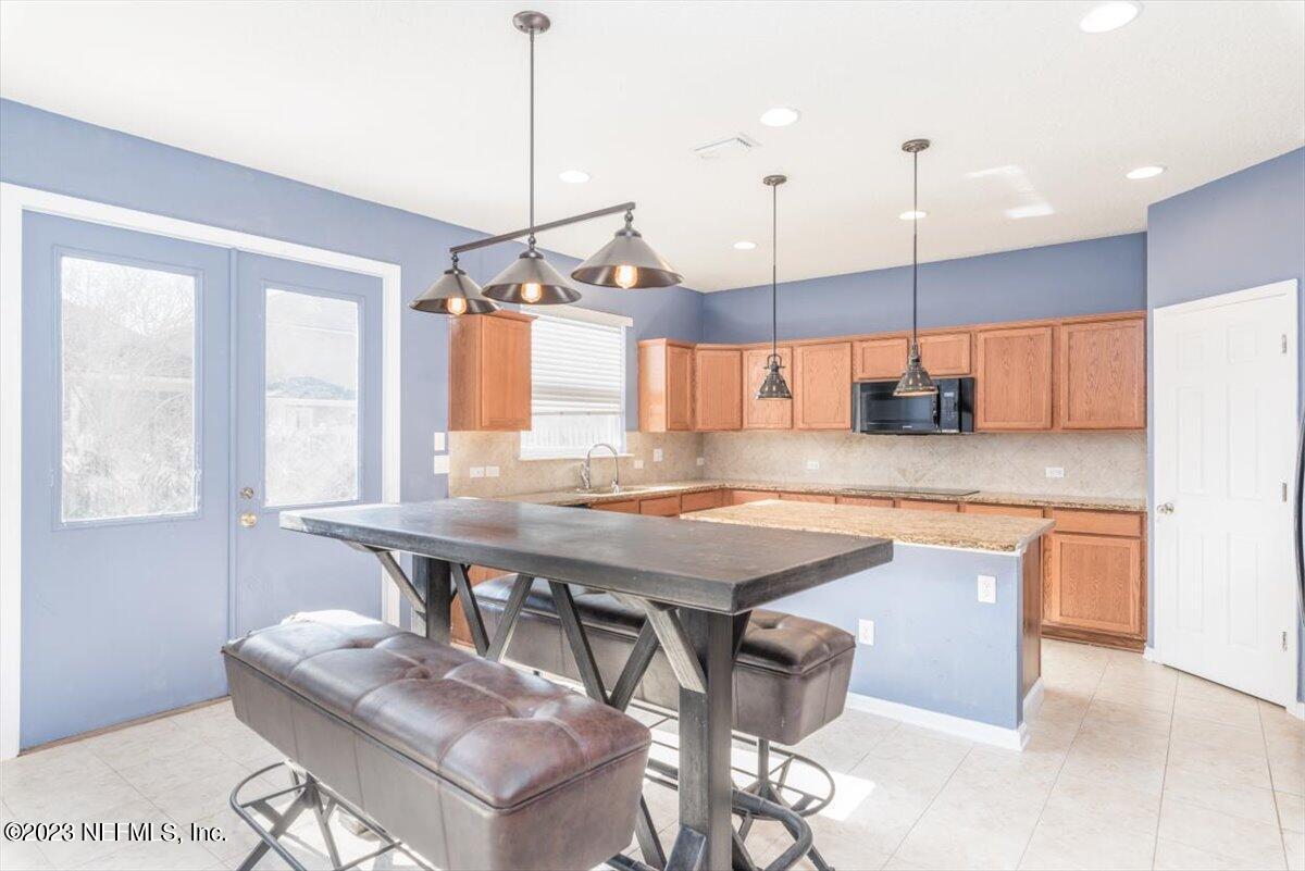 1415 Lantern Light Trail Middleburg, FL 32068 - Photo 21 of 63 Kitchen to Patio