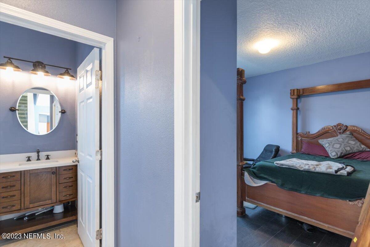 1415 Lantern Light Trail Middleburg, FL 32068 - Photo 30 of 63 1st Floor Bedroom to Bathroom