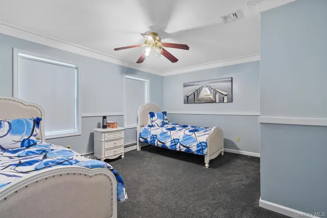 a bedroom with bed and a chandelier