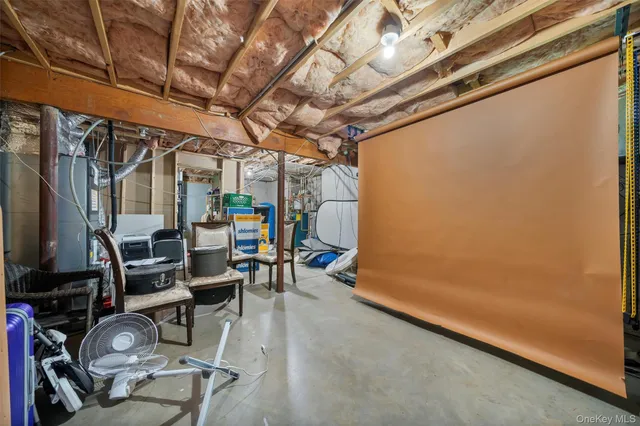 a view of a room with wooden floor and furniture