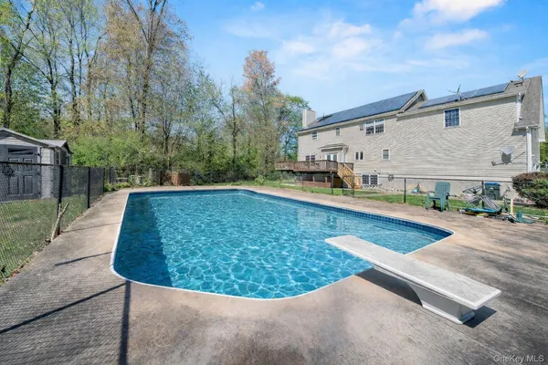 a view of a swimming pool with a patio