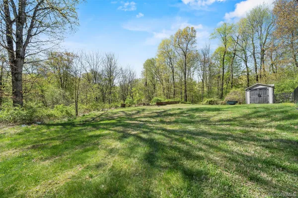 a swimming pool is in the middle of a garden
