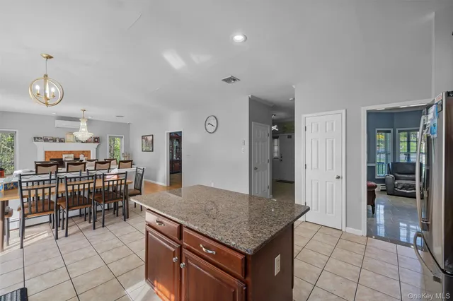 an open kitchen with dining table and chairs