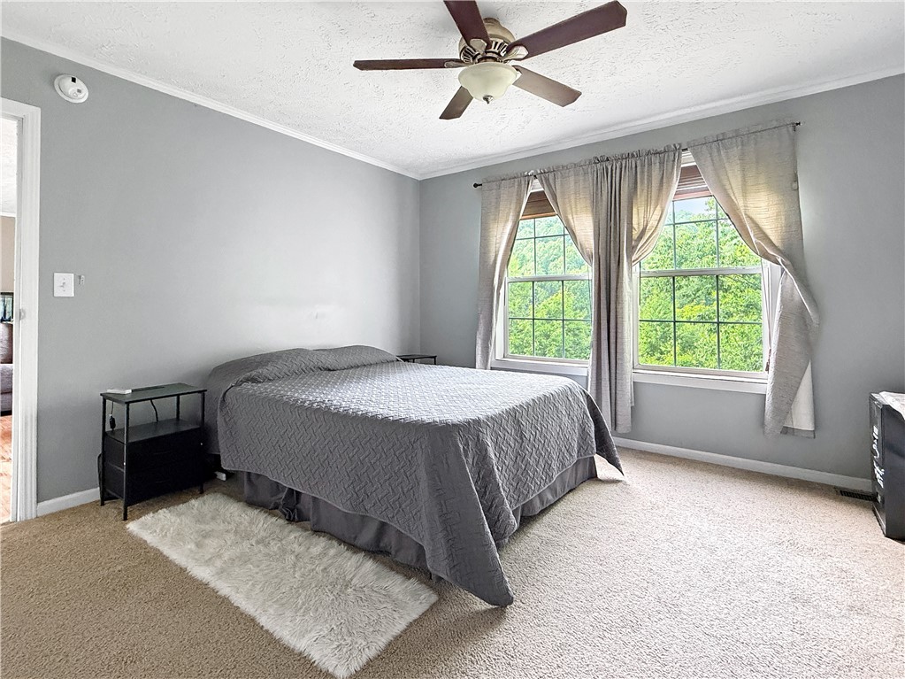1173 Hopewell Church Road Boone, NC 28607 - Photo 13 of 39 a spacious bedroom with a bed and window