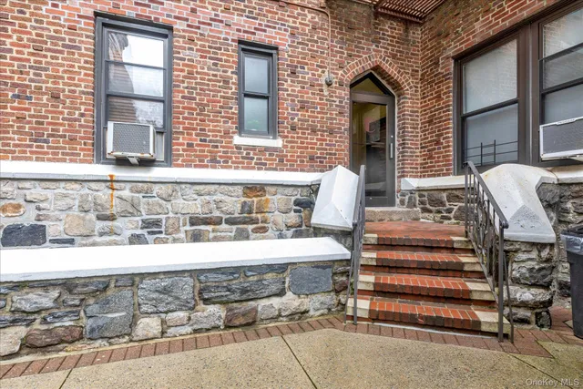 a front view of a house with wooden fence