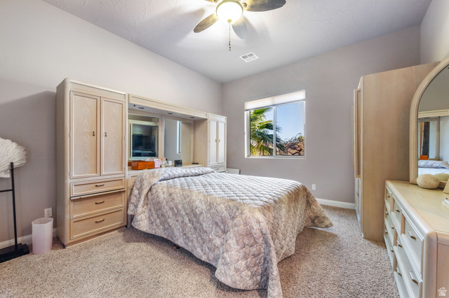 2376 Stone Crest Circle St. George, UT 84790 - Photo 42 of 61 Bedroom with light colored carpet and ceiling fan